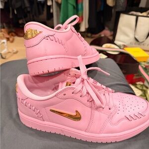Nike Women's Pink Sneakers with Gold Details